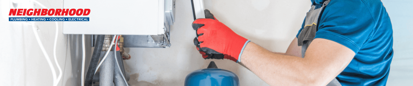 An HVAC professional examining furnace noises, furnace's blower wheel, whistling noises, and squealing noise.