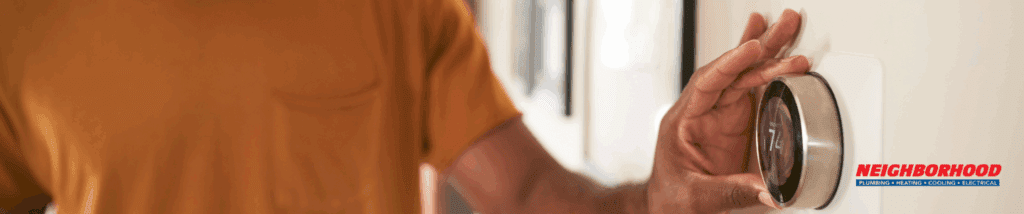 hvac tech checks thermostat battery affecting furnace